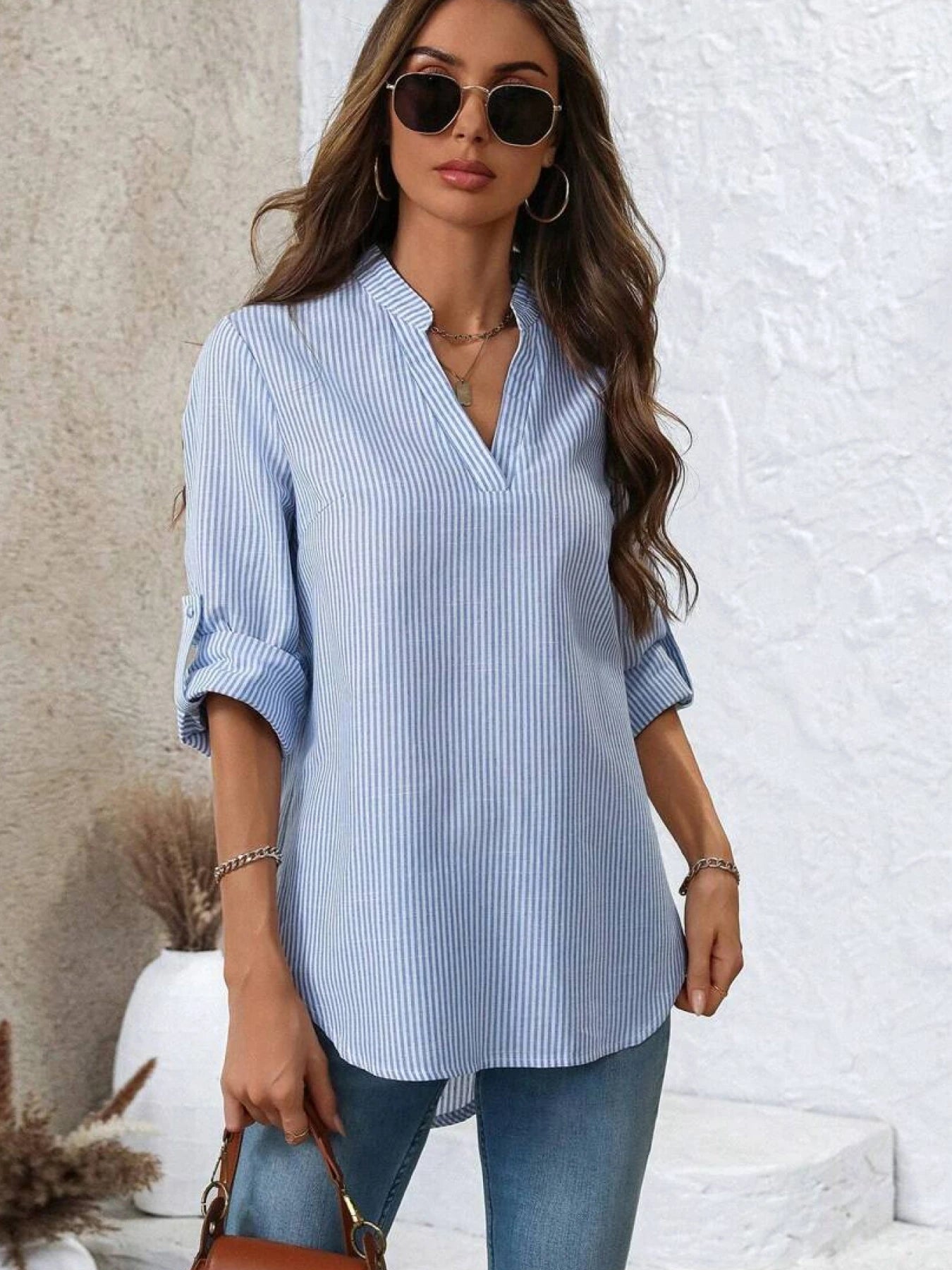 A women's blue and white vertical striped V-neck medium-sleeved loose shirt casual commuting style thin and light top